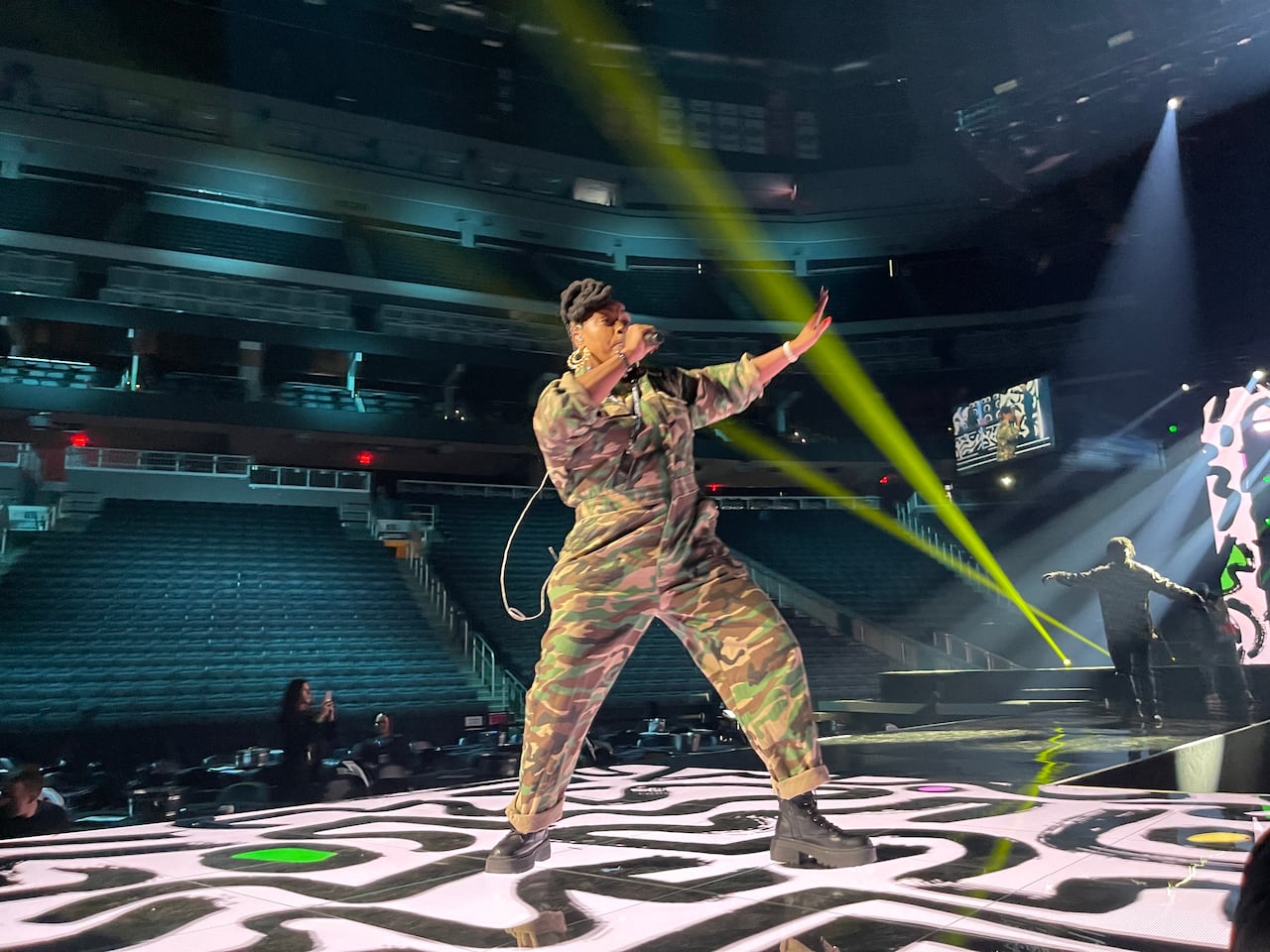 A woman raps on stage