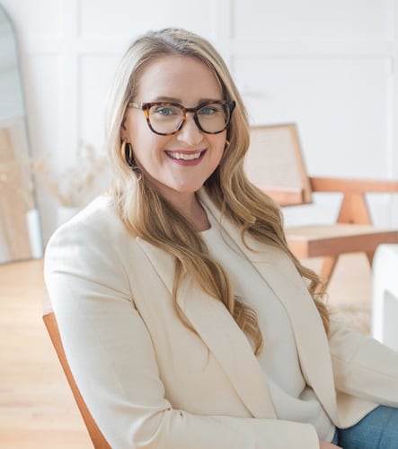 A woman sits in an office