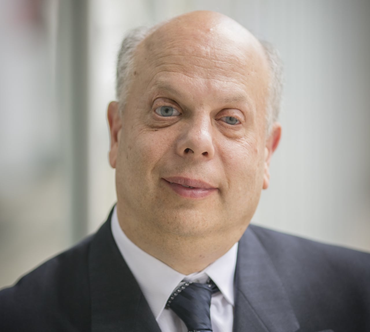 Man in suit facing camera